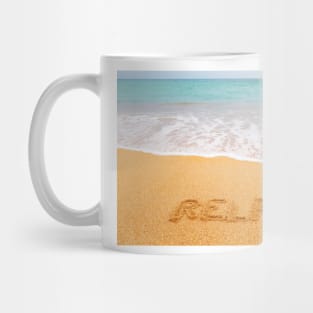 Inscription "RELAX" made on beautiful beach by the blue sea Mug